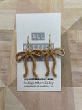 Gorgeous skinny ribbon bow dangle earring